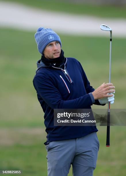 Joe Root of England the former England Test cricket captain and leading batsman plays his second shot on the second hole on Day One of the Alfred...