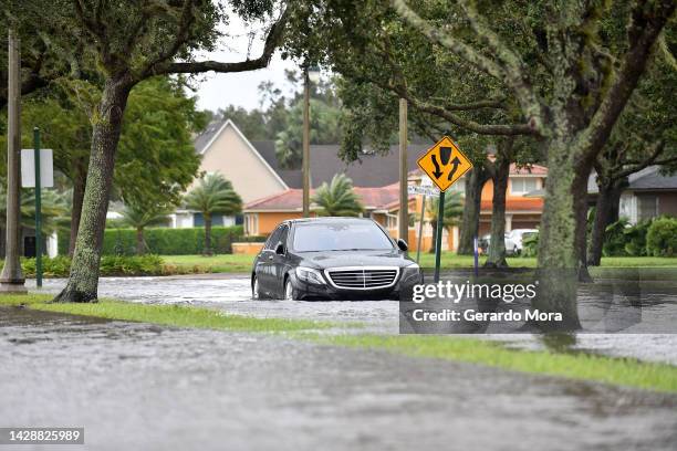 Car is seen in a flooded road after being hit by the winds and rain from Hurricane Ian on September 29, 2022 in Sanford, Florida. The hurricane...