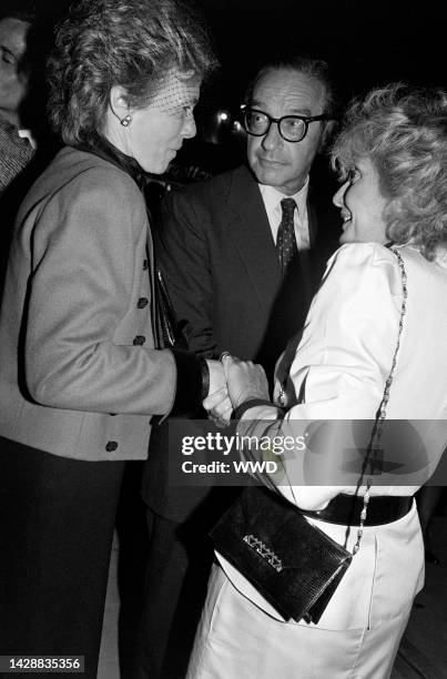 Liz Rohatyn, Alan Greenspan, and Barbara Walters attend a service at the Church of St. Vincent Ferrer in New York City on September 14, 1983.