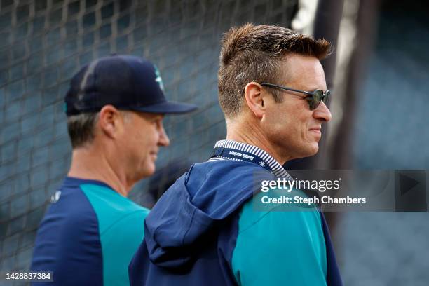 Manager Scott Servais and General Manager Jerry DiPoto of the Seattle Mariners look on during batting practice before the game against the Texas...