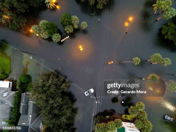 In this aerial view, cars sit in floodwater near downtown after Hurricane Ian on September 29, 2022 in Orlando, Florida. The hurricane brought high...