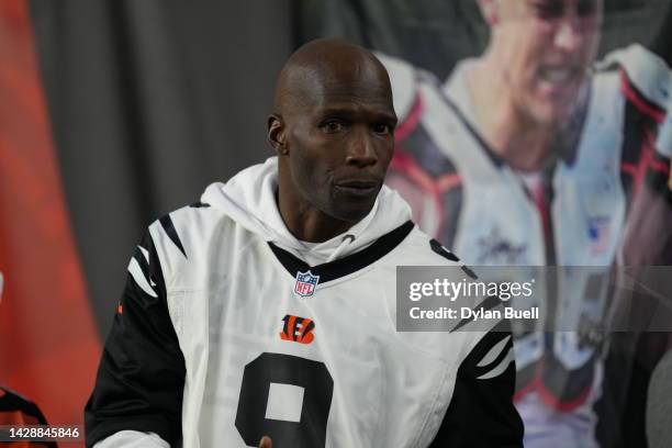 Chad Ochocinco watches pre-game warm-ups prior to the game between the Miami Dolphins and the Cincinnati Bengals at Paycor Stadium on September 29,...