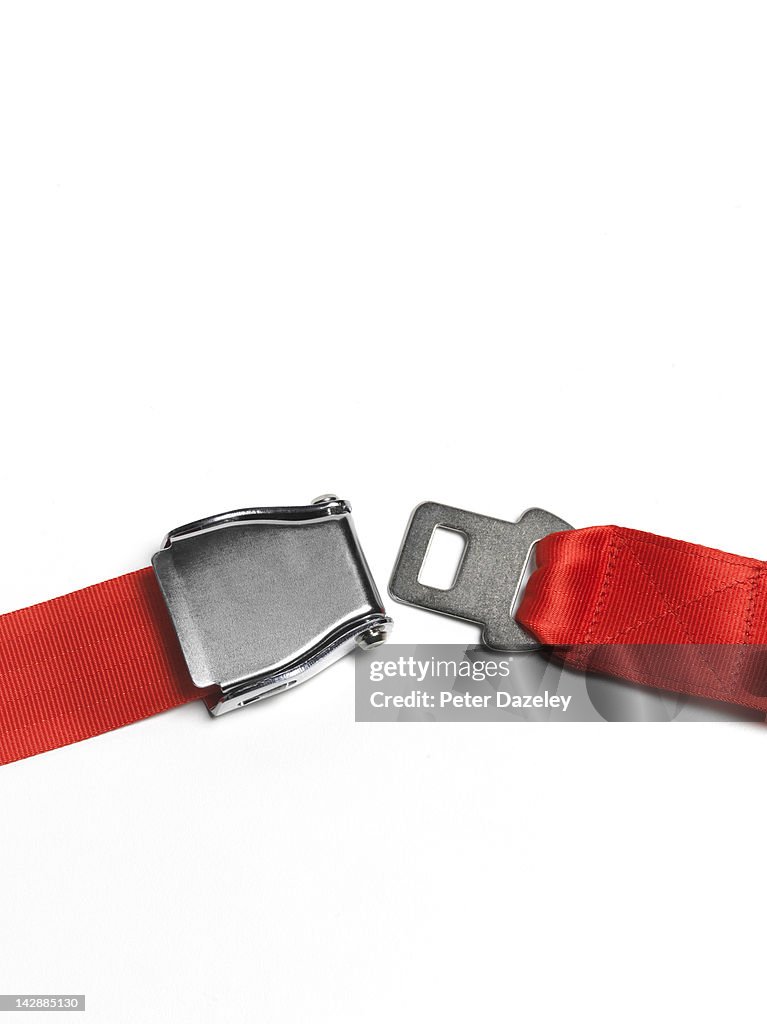 Red seat belt unfastened, angle