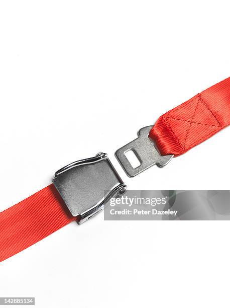 red seat belt unfastened, straight - seatbelt stock pictures, royalty-free photos & images