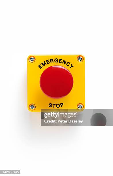 close up of emergency stop panic button with - important message stockfoto's en -beelden