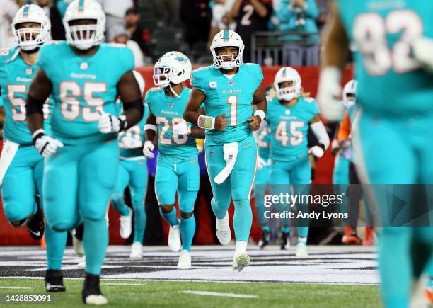 Quarterback Tua Tagovailoa of the Miami Dolphins jogs out of the tunnel onto the field prior to the game against the Cincinnati Bengals at Paycor...