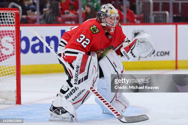 Alex Stalock of the Chicago Blackhawks tends the goal against the St. Louis Blues during the third period of a preseason game at United Center on...
