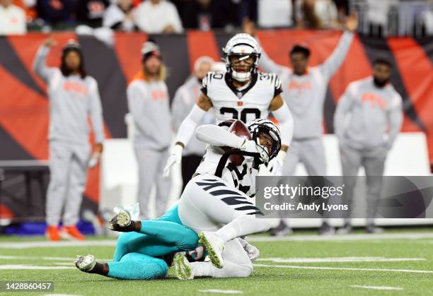 Safety Vonn Bell of the Cincinnati Bengals is tackled after making an interception during the 1st quarter of the game against the Miami Dolphins at...