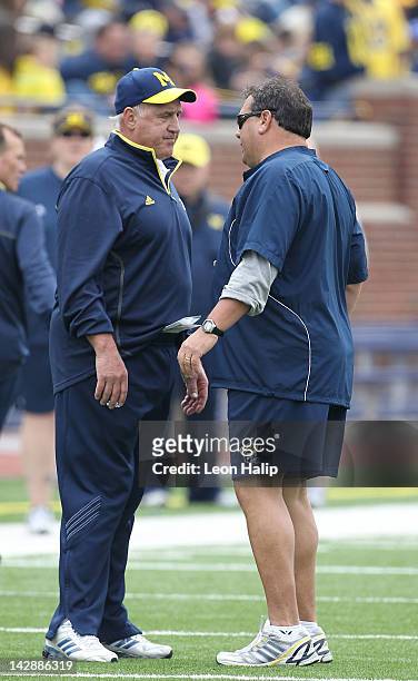 Michigan Wolverines defensive Coordinator Greg Mattison talks with head football coach Brady Hoke watches the action during the annual Michigan...