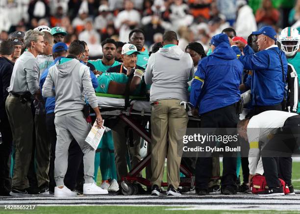 Medical staff tend to quarterback Tua Tagovailoa of the Miami Dolphins as he is carted off on a stretcherafter an injury during the 2nd quarter of...