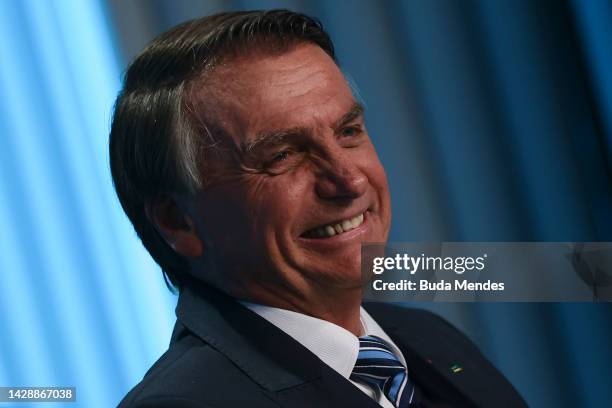 President of Brazil and presidential candidate Jair Bolsonaro smiles during the third and final debate organized by Globo ahead of presidential...