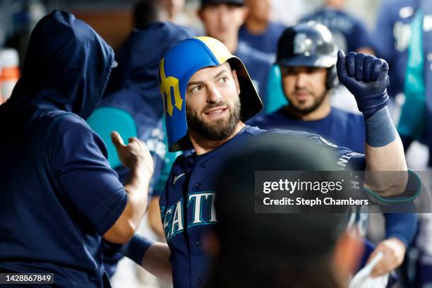 Mitch Haniger of the Seattle Mariners celebrates his two-run home run against the Texas Rangers during the first inning at T-Mobile Park on September...