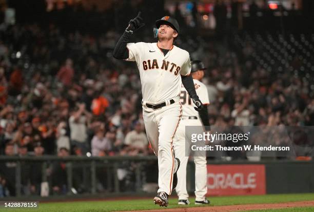 Ford Proctor of the San Francisco Giants celebrates after he hit a grand slam home run against the Colorado Rockies in the bottom of the second...