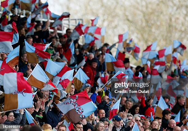 Fans wave their flags during the Aviva Premiership match between Harlequins and London Wasps at Twickenham Stoop on April 14, 2012 in London, England.