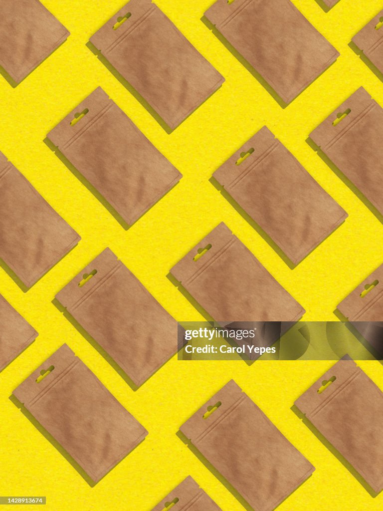 Brown envelope seamless pattern in yellow background