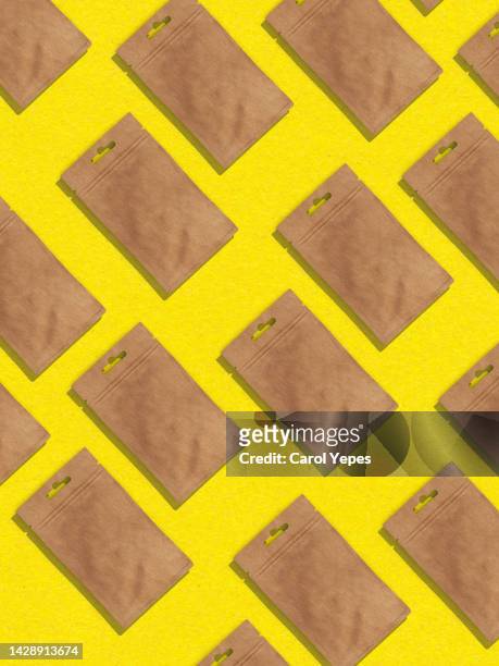 brown envelope  seamless pattern in yellow background - manila envelope stock pictures, royalty-free photos & images