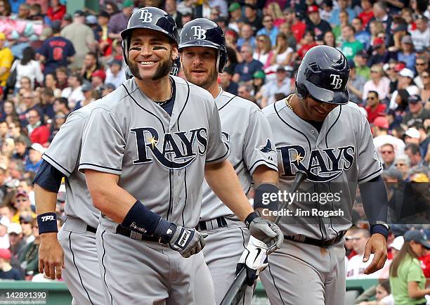 Luke Scott of the Tampa Bay Rays celebrates with teammates after he hit a three-run home run in the first inning against the Boston Red Sox at Fenway...