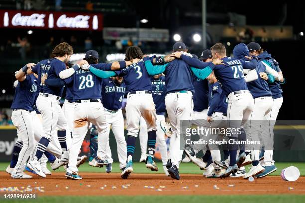 The Seattle Mariners celebrate after beating Texas Rangers 10-9 during the eleventh inning at T-Mobile Park on September 29, 2022 in Seattle,...