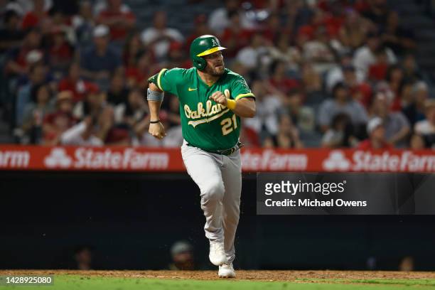 Stephen Vogt of the Oakland Athletics runs to first base against the Los Angeles Angels during the ninth inning at Angel Stadium of Anaheim on...