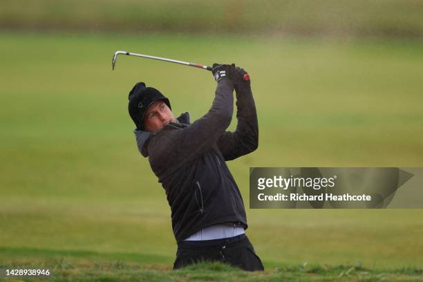 Joe Root of England plays a shot from the bunker on the 18th hole on Day Two of the Alfred Dunhill Links Championship at Carnoustie Golf Links on...