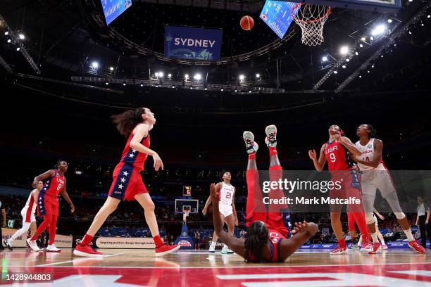 Jewel Loyd of the United States falls as Nirra Fields of Canada shoots during the 2022 FIBA Women's Basketball Semi Final match between Canada and...