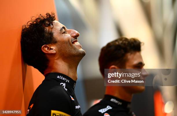 Daniel Ricciardo of Australia and McLaren and Lando Norris of Great Britain and McLaren look on in the Paddock during previews ahead of the F1 Grand...