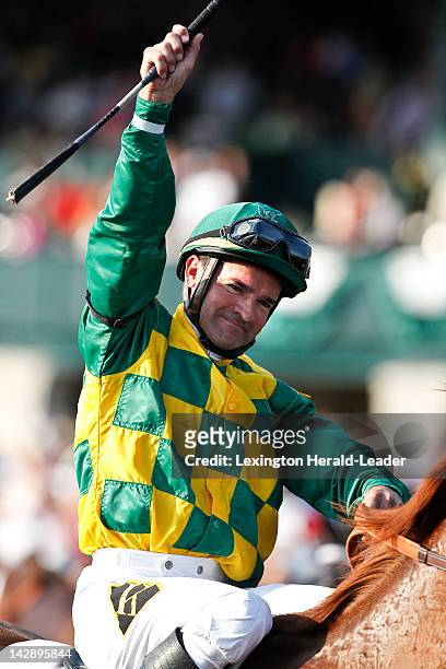 Jockey Kent Desormeaux salutes the crowd after riding Dullahan to victory in the 88th running of the Toyota Blue Grass Stakes in Lexington, Kentucky,...