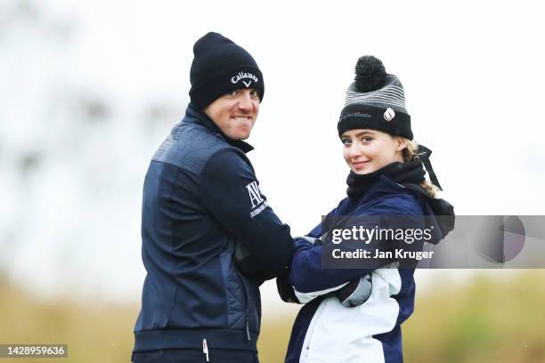 Matt Wallace of England and playing partner, Kathryn Newton interact on the 11th hole on Day Two of the Alfred Dunhill Links Championship at...