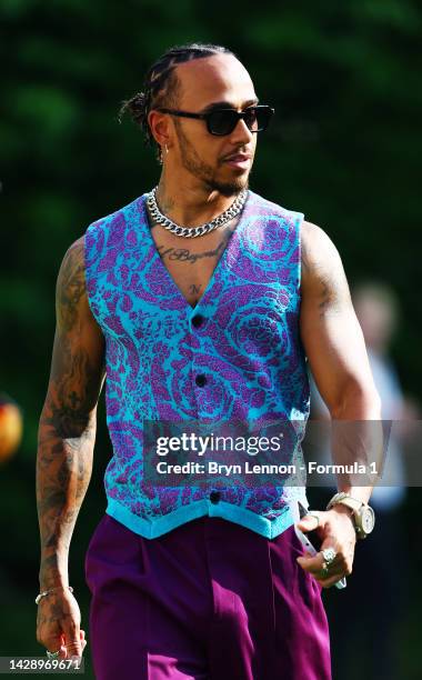 Lewis Hamilton of Great Britain and Mercedes walks in the Paddock prior to practice ahead of the F1 Grand Prix of Singapore at Marina Bay Street...