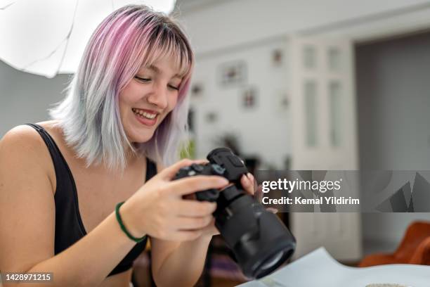 adolescence girl taking photos for her school project - editing room stock pictures, royalty-free photos & images