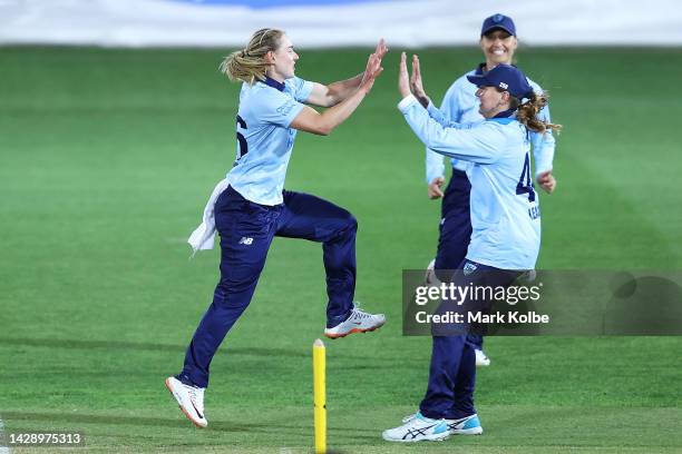 Maitlan Brown of the NSW Breakers celebrates with her team after taking the wicket of Chloe Piparo of Western Australia during the WNCL match between...