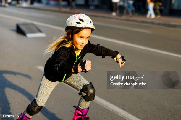 cute little girl rides roller skates - extreme skating stock pictures, royalty-free photos & images