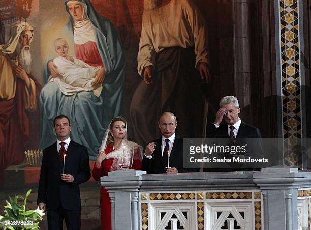 Russian Prime Minister Vladimir Putin , Moscow Mayor Sergey Sobyanin , President Dmitry Medvedev and his wife Svetlana Medvedeva attend an Easter...