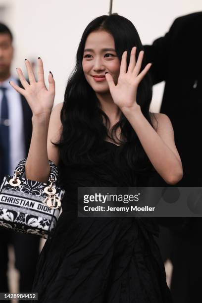 Jisoo seen wearing a black shoulder free dress and a lady d-lite bag by dior, outside Christian Dior during Paris Fashion Week on September 27, 2022...