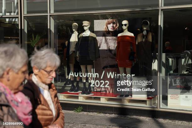 Two elderly women walk past a clothing store on September 30, 2022 in Berlin, Germany. Inflation in Germany reaches 10.9% in September compared to...