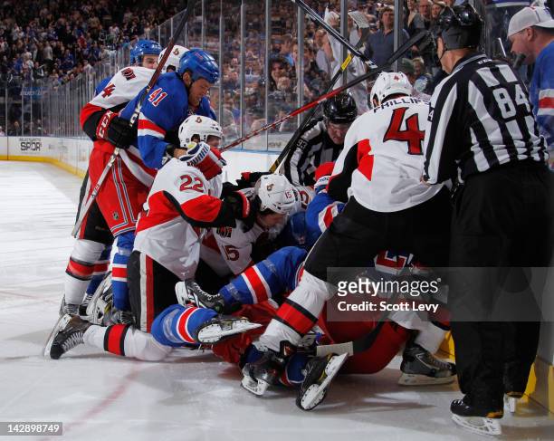 The New York Rangers fight with the Ottawa Senators in Game Two of the Eastern Conference Quarterfinals during the 2012 NHL Stanley Cup Playoffs at...