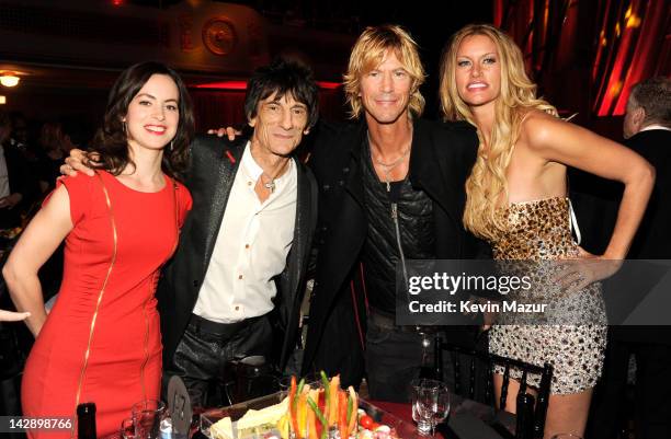 Inductee Ron Wood of Faces, inductee Duff McKagan of Guns N' Roses and Susan Holmes attends the 27th Annual Rock And Roll Hall Of Fame Induction...