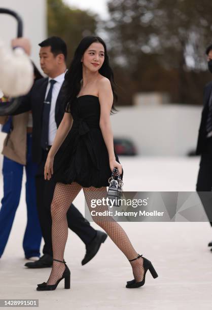 Jisoo seen wearing a black shoulder free minidress with a lady d-lite bag by dior, outside Christian Dior during Paris Fashion Week on September 27,...