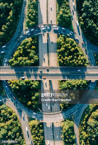 an aerial sunrise view of a multi-lane road  intersection - échangeur photos et images de collection