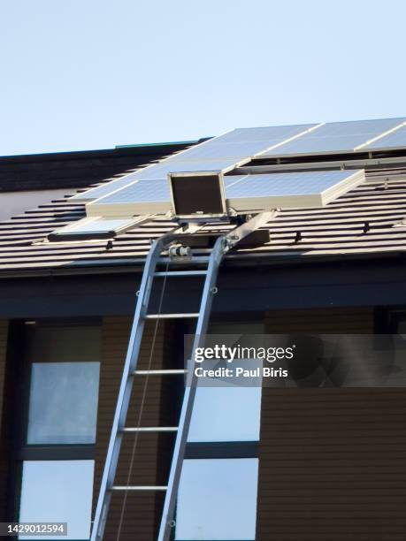 installing solar panels on residential rooftop - upper_house stock-fotos und bilder