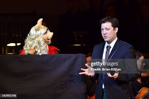 Host John Tartaglia performs with Miss Piggie during The New York Pops Present "Jim Henson's Musical World" at Carnegie Hall on April 14, 2012 in New...