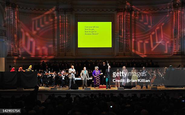 The cast of Sesame Street performs with host John Tartaglia during The New York Pops Present "Jim Henson's Musical World" at Carnegie Hall on April...