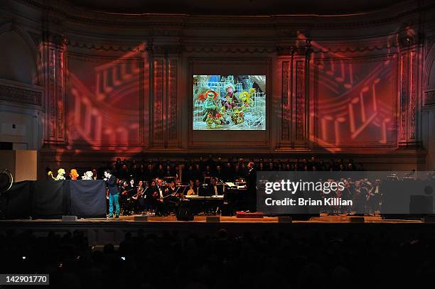 Host John Tartaglia performs with Muppets from Fraggle Rock during The New York Pops Present "Jim Henson's Musical World" at Carnegie Hall on April...