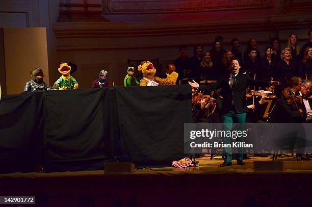 Host John Tartaglia performs with Fozzie Bear, Kermit the Frog, Gonzo, and Scooter during The New York Pops Present "Jim Henson's Musical World" at...