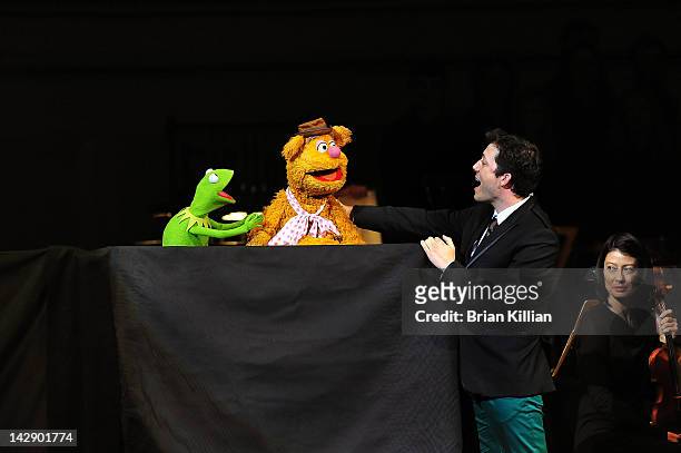 Host John Tartaglia performs with Kermit the Frog and Fozzie Bear during The New York Pops Present "Jim Henson's Musical World" at Carnegie Hall on...