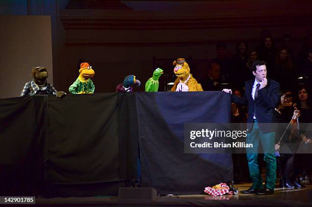 Host John Tartaglia performs with Fozzie Bear, Keermit the Frog, Gonzo, and Scooter during The New York Pops Present "Jim Henson's Musical World" at...