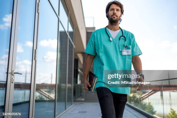 low angle view of male healthcare worker - low confidence stock pictures, royalty-free photos & images