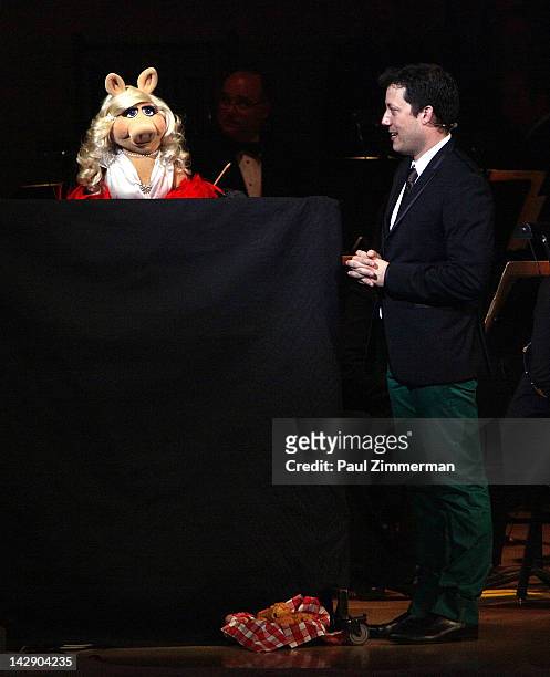 Miss Piggy and host John Tartaglia perfom during The New York Pops Present "Jim Henson's Musical World" at Carnegie Hall on April 14, 2012 in New...