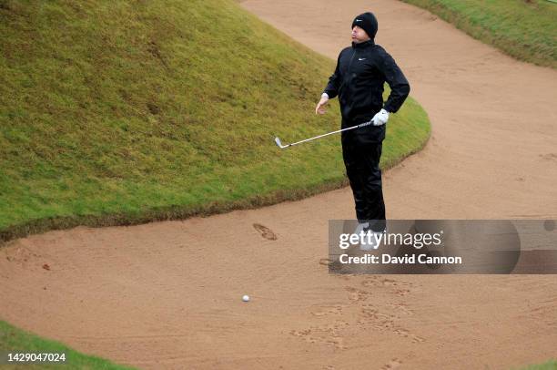 Rory McIlroy of Northern Ireland leaps to see his shot line before he plays his second shot on the fifth hole during Day Two of the Alfred Dunhill...