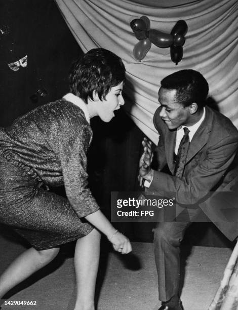 British singer and actress Helen Shapiro and South African-born British singer Danny Williams dancing at an Christmas party, London, England,...